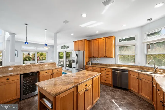 a living room with fireplace furniture and a floor to ceiling window