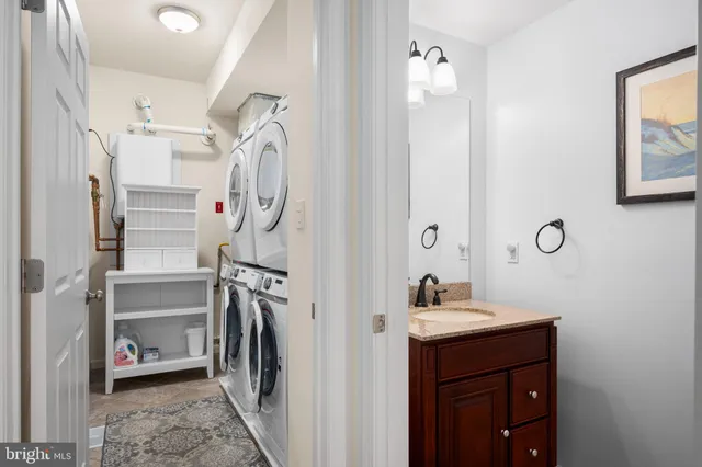a living room with furniture and large windows