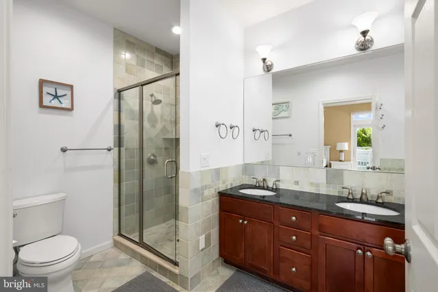 a bathroom with a tub sink and window