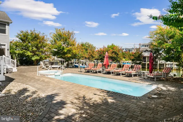 an aerial view of a house with a lake view