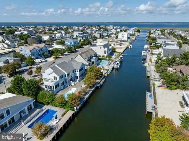 an aerial view of a city with ocean view