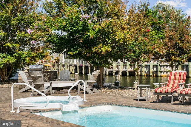 a view of backyard of house with seating space