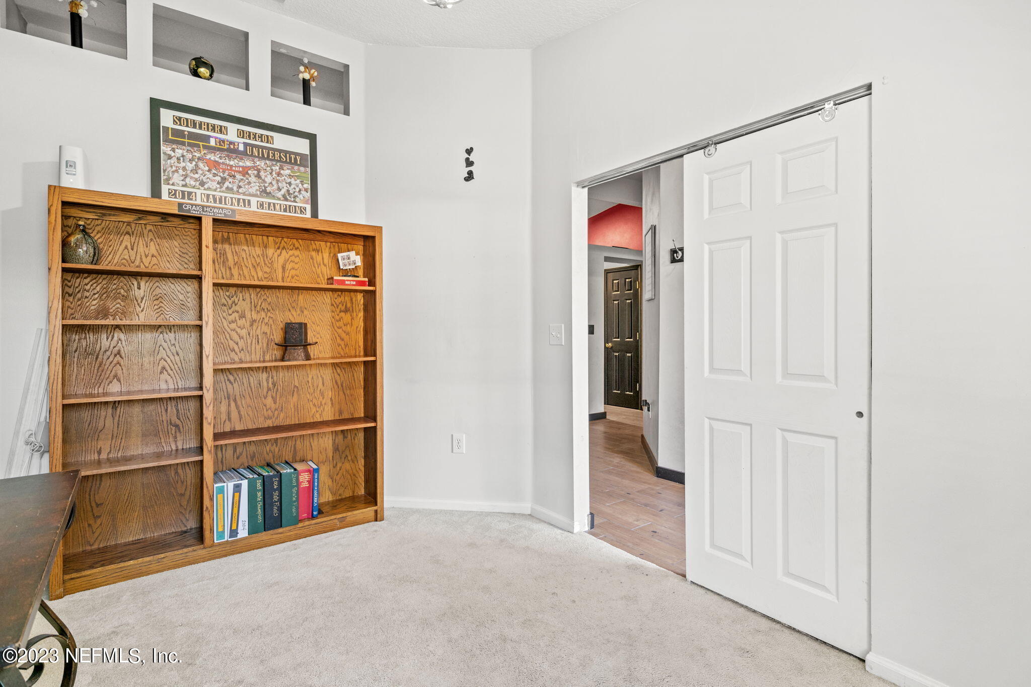 944 North Lilac Loop St. Johns, FL 32259 - Photo 12 of 32 a view of a hallway with shelves