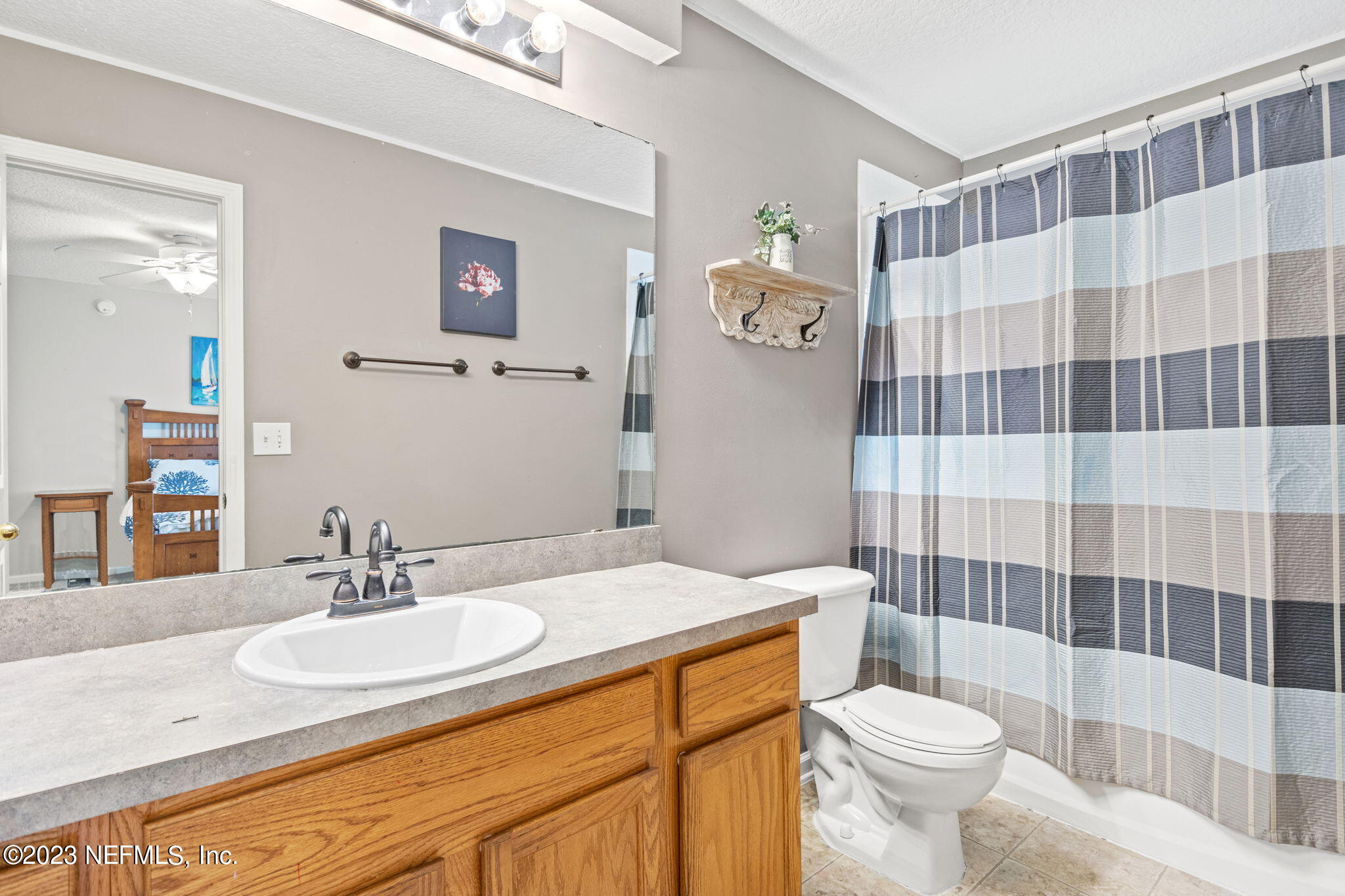 944 North Lilac Loop St. Johns, FL 32259 - Photo 16 of 32 a bathroom with a sink toilet and shower