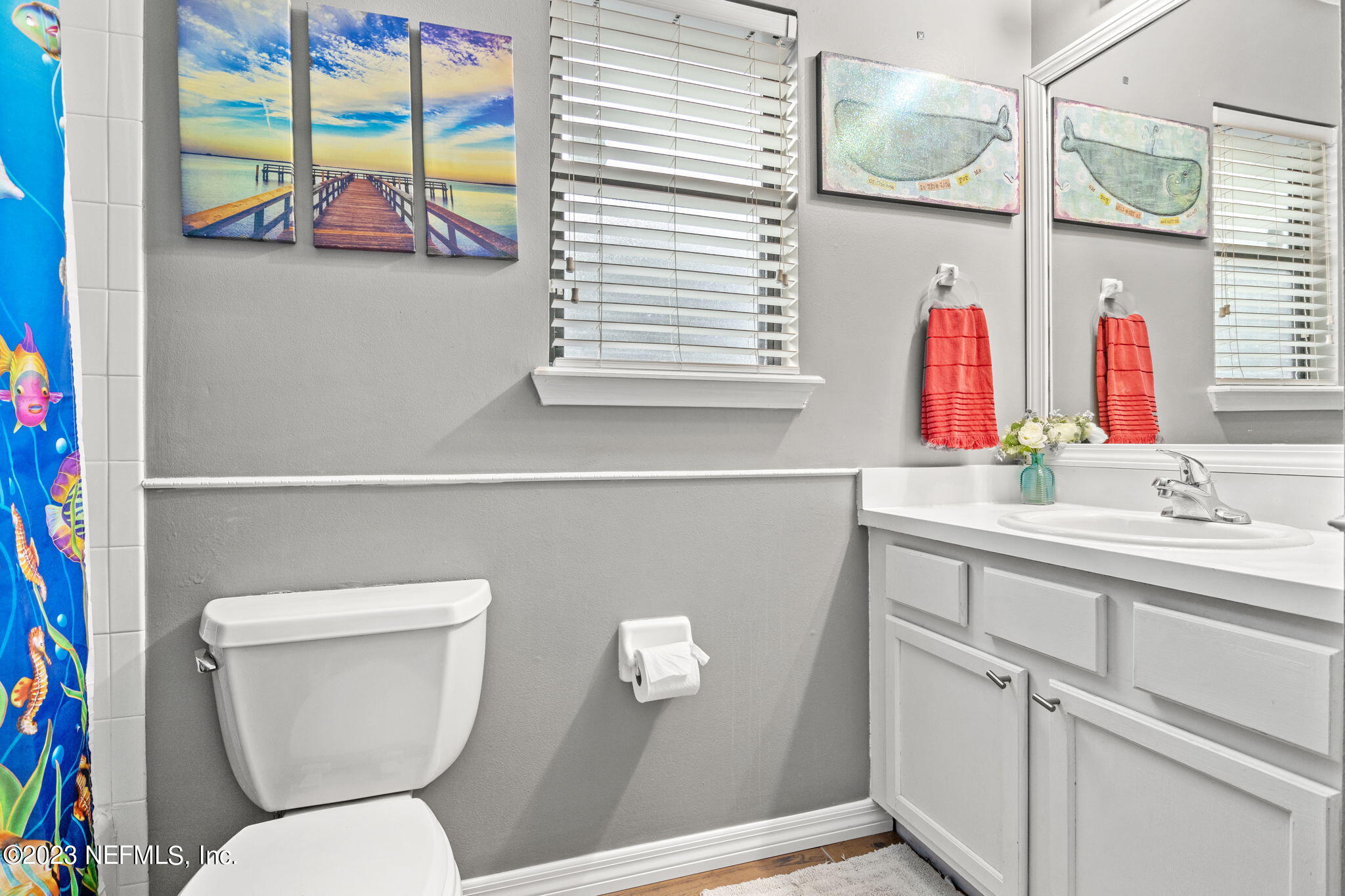 944 North Lilac Loop St. Johns, FL 32259 - Photo 21 of 32 a bathroom with a toilet sink and mirror