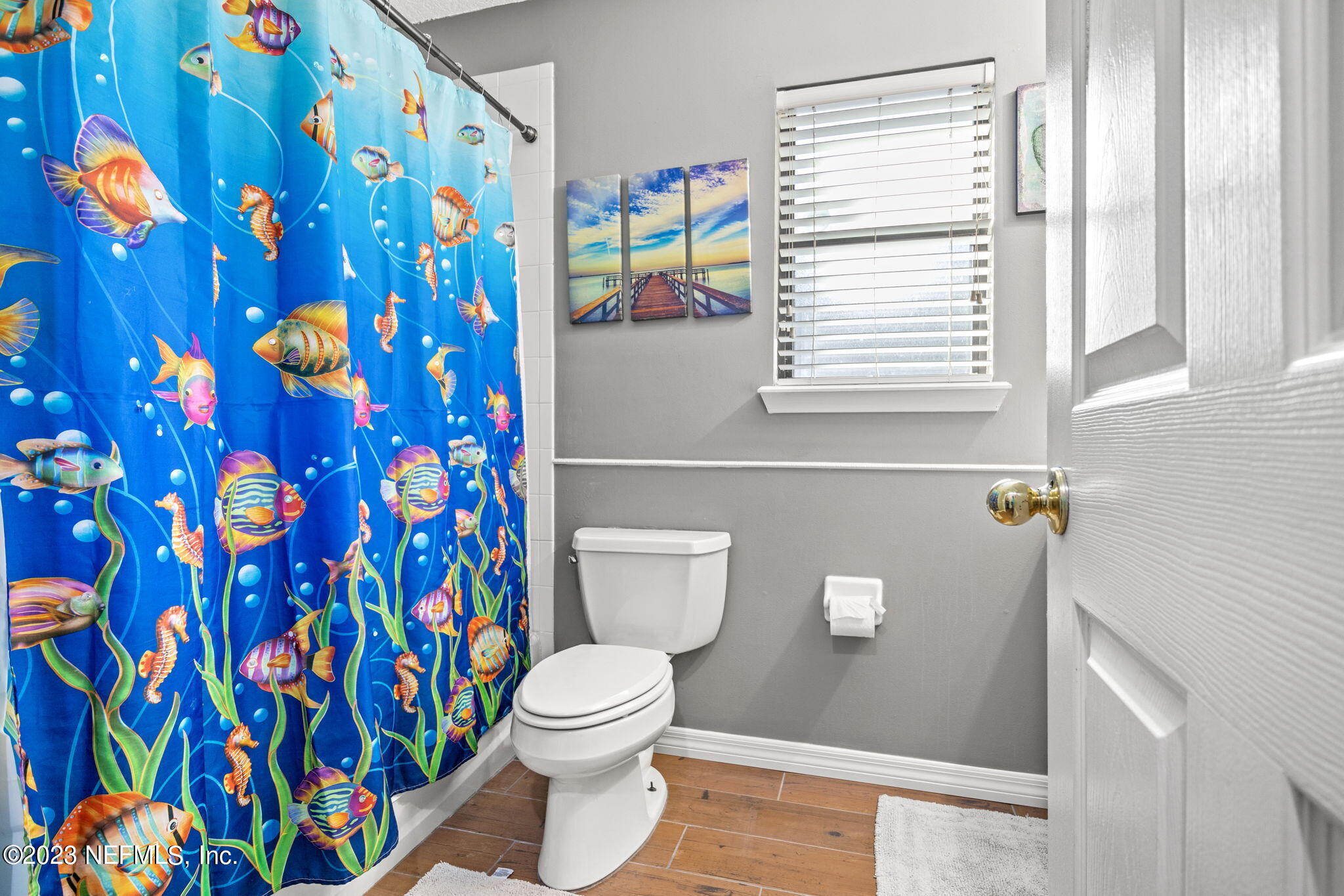 944 North Lilac Loop St. Johns, FL 32259 - Photo 22 of 32 a bathroom with a toilet and a shower curtain