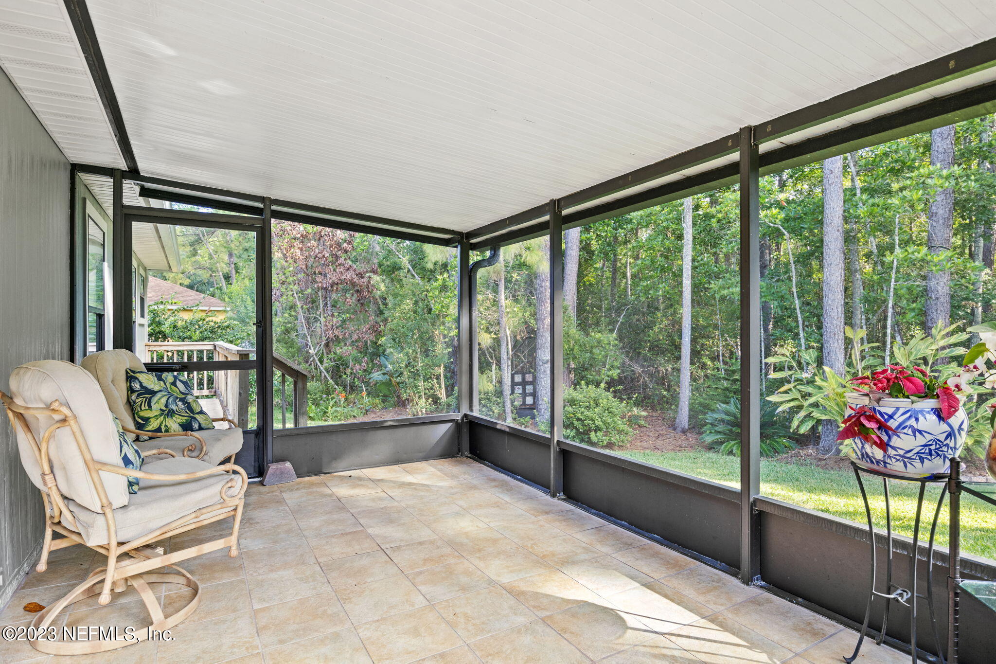 944 North Lilac Loop St. Johns, FL 32259 - Photo 26 of 32 a living room with glass windows and furniture