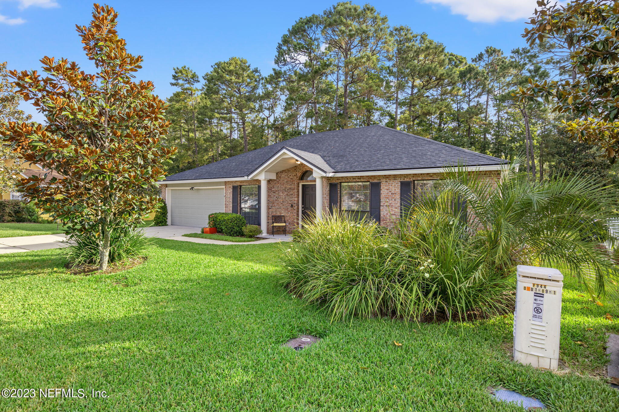 944 North Lilac Loop St. Johns, FL 32259 - Photo 28 of 32 a front view of a house with a yard and green space