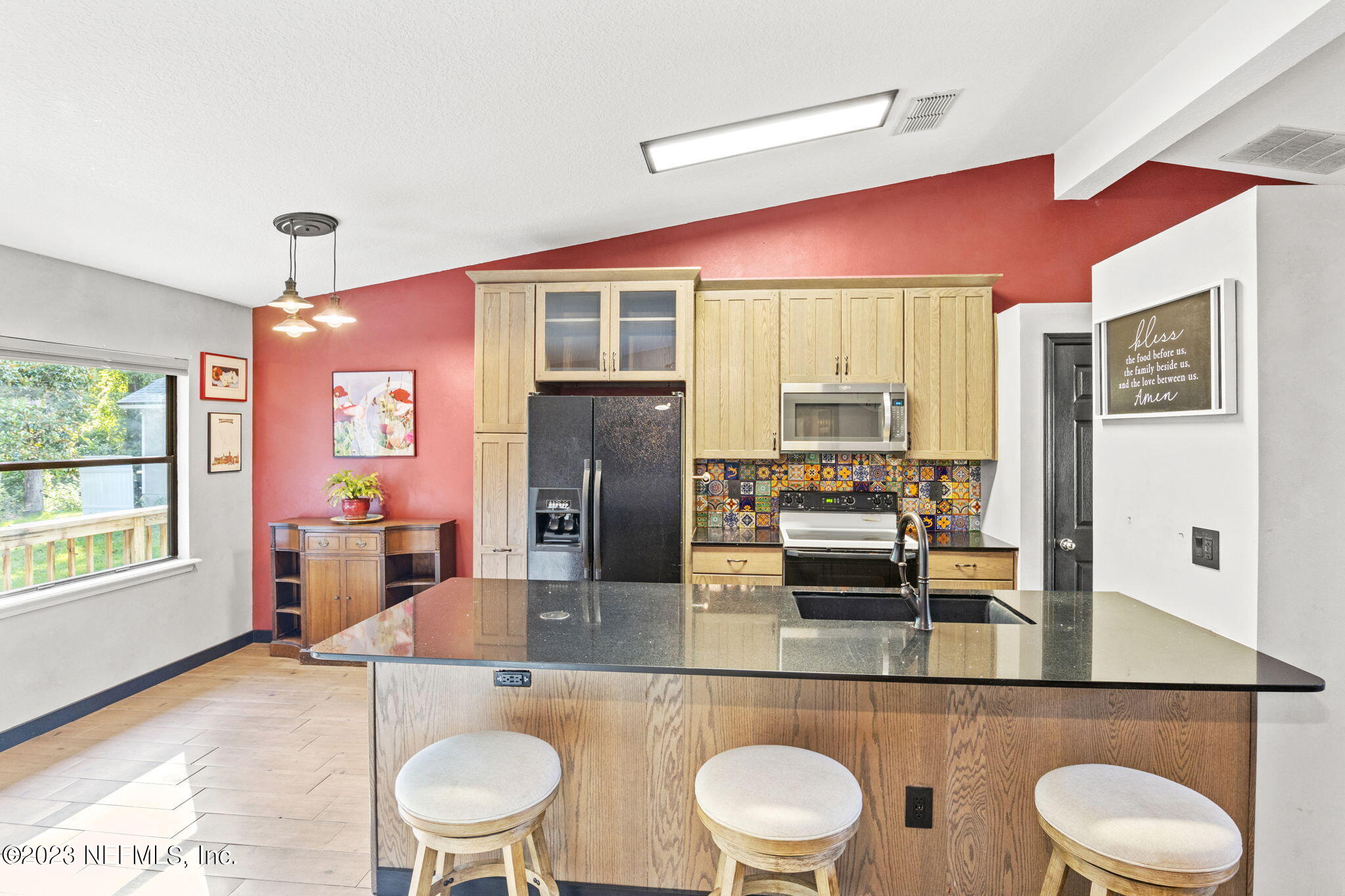 944 North Lilac Loop St. Johns, FL 32259 - Photo 3 of 32 a kitchen with stainless steel appliances granite countertop a sink and refrigerator