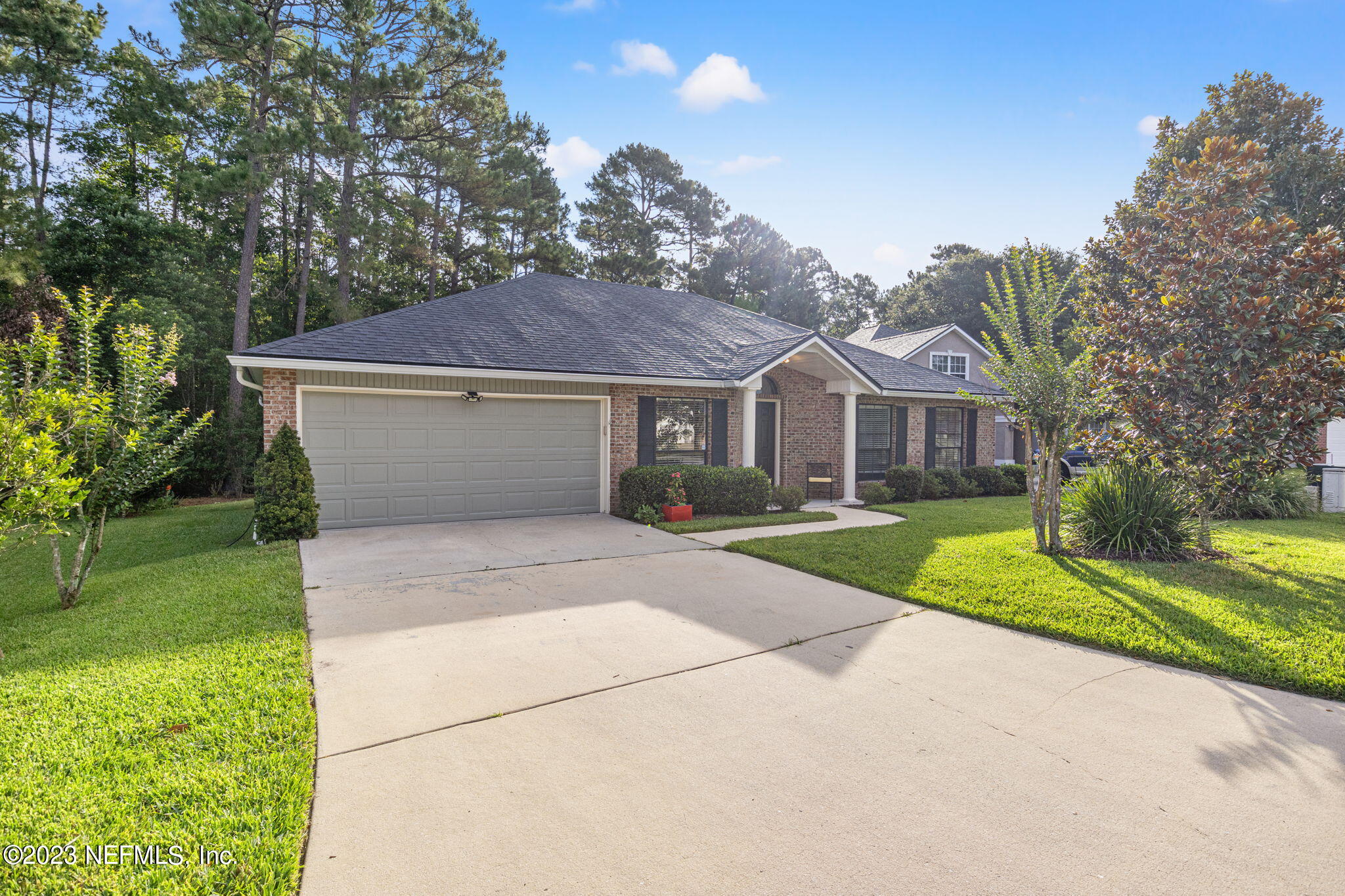 944 North Lilac Loop St. Johns, FL 32259 - Photo 32 of 32 a front view of a house with a yard