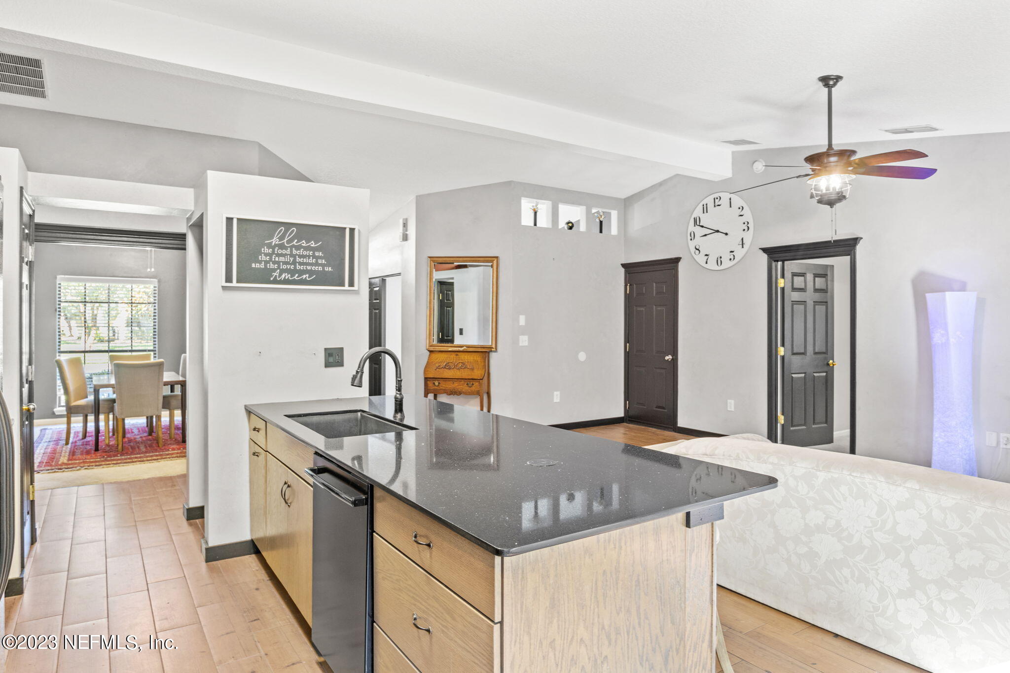 944 North Lilac Loop St. Johns, FL 32259 - Photo 4 of 32 a kitchen with a sink a counter space and stainless steel appliances