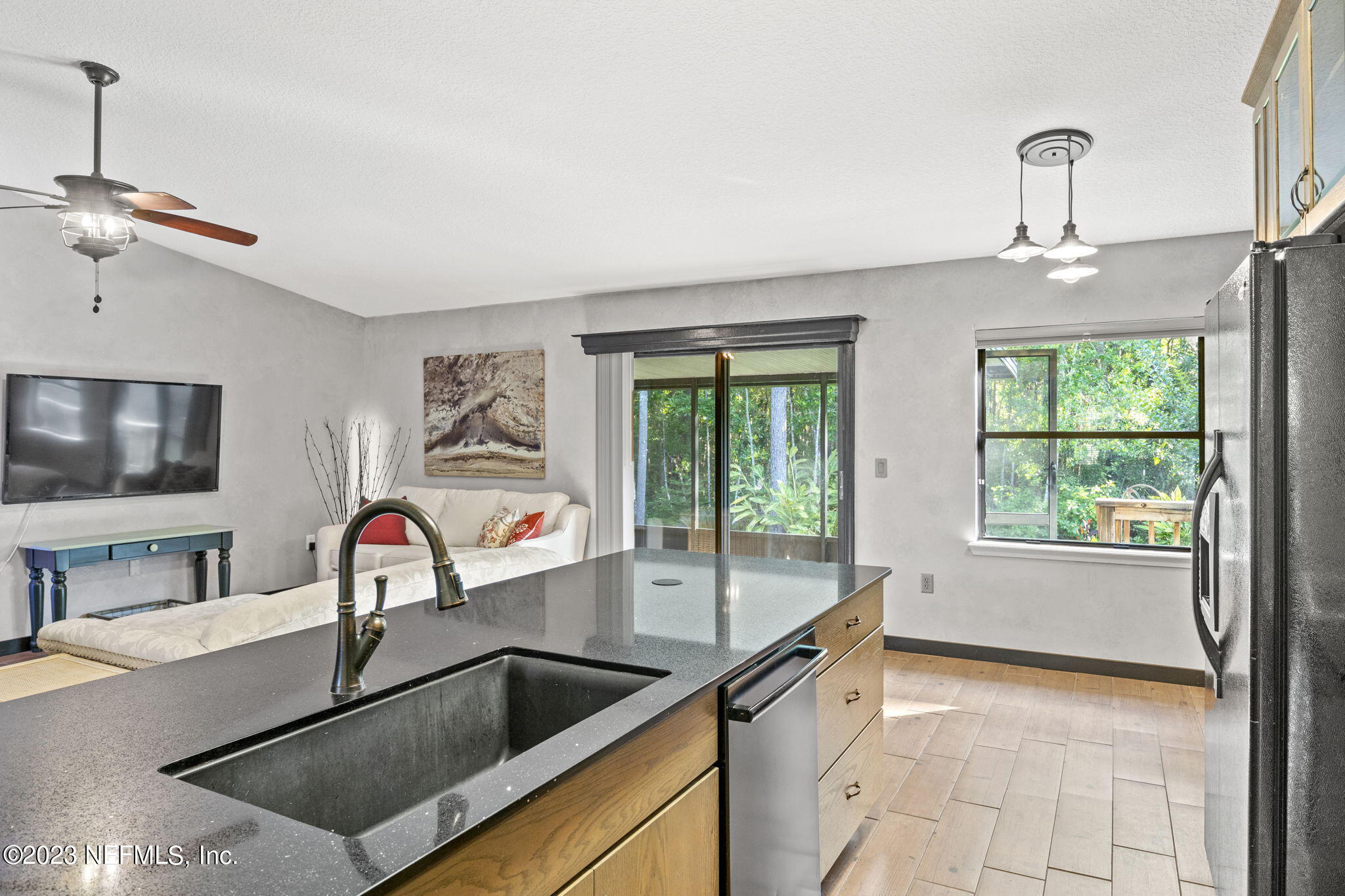 944 North Lilac Loop St. Johns, FL 32259 - Photo 5 of 32 a kitchen with a sink a counter top space and stainless steel appliances