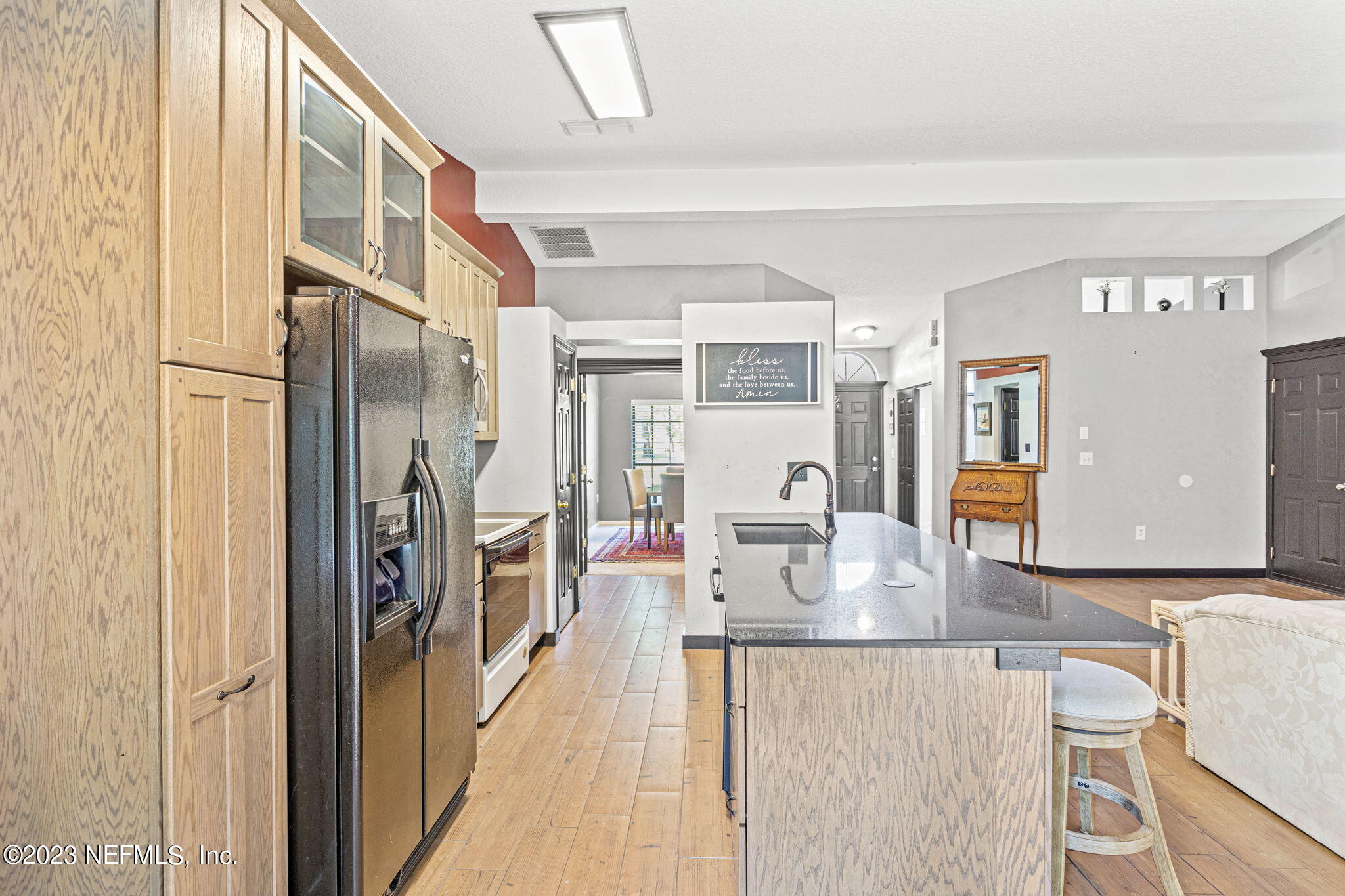944 North Lilac Loop St. Johns, FL 32259 - Photo 6 of 32 a kitchen with stainless steel appliances granite countertop a refrigerator and microwave