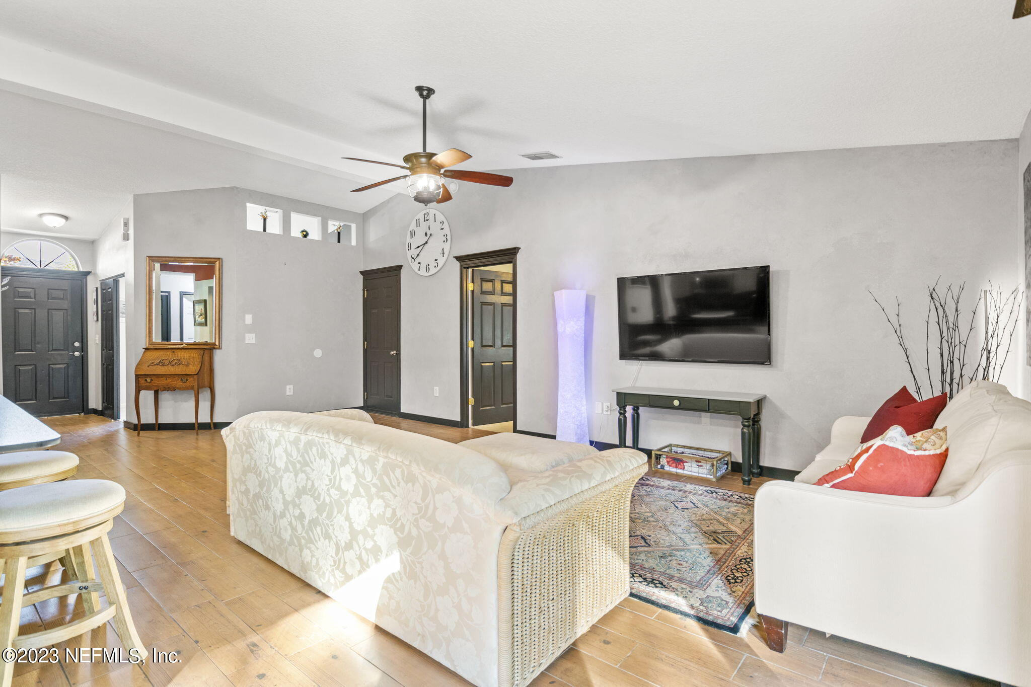 944 North Lilac Loop St. Johns, FL 32259 - Photo 9 of 32 a living room with furniture and a flat screen tv