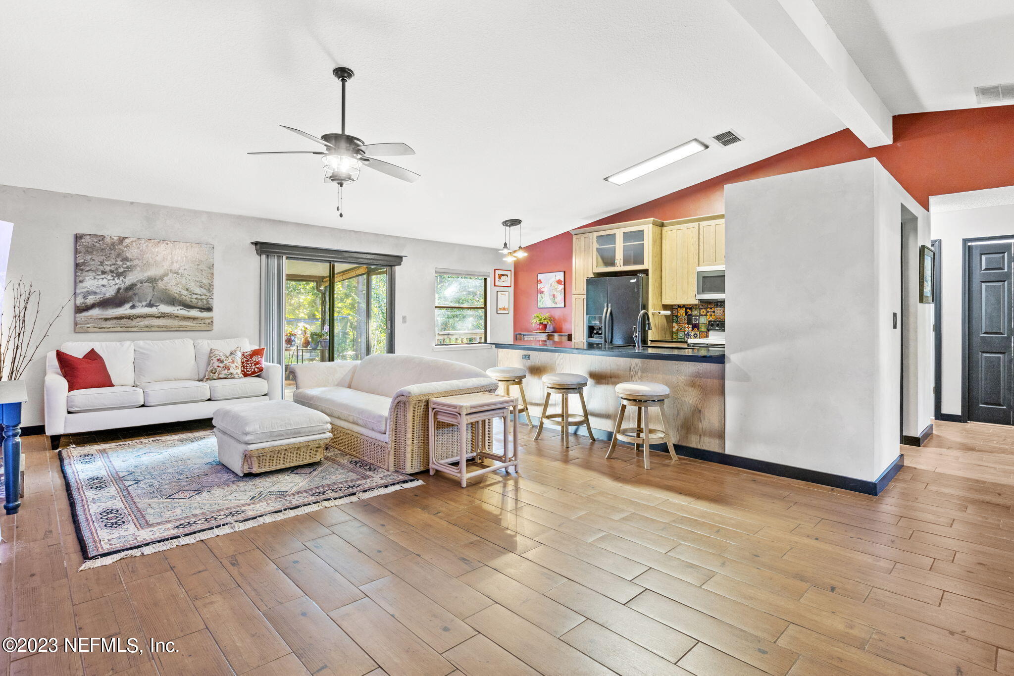 944 North Lilac Loop St. Johns, FL 32259 - Photo 10 of 32 a living room with furniture and wooden floor