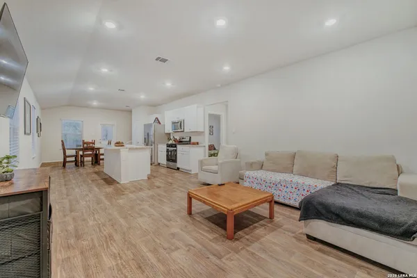 a living room with furniture and a table