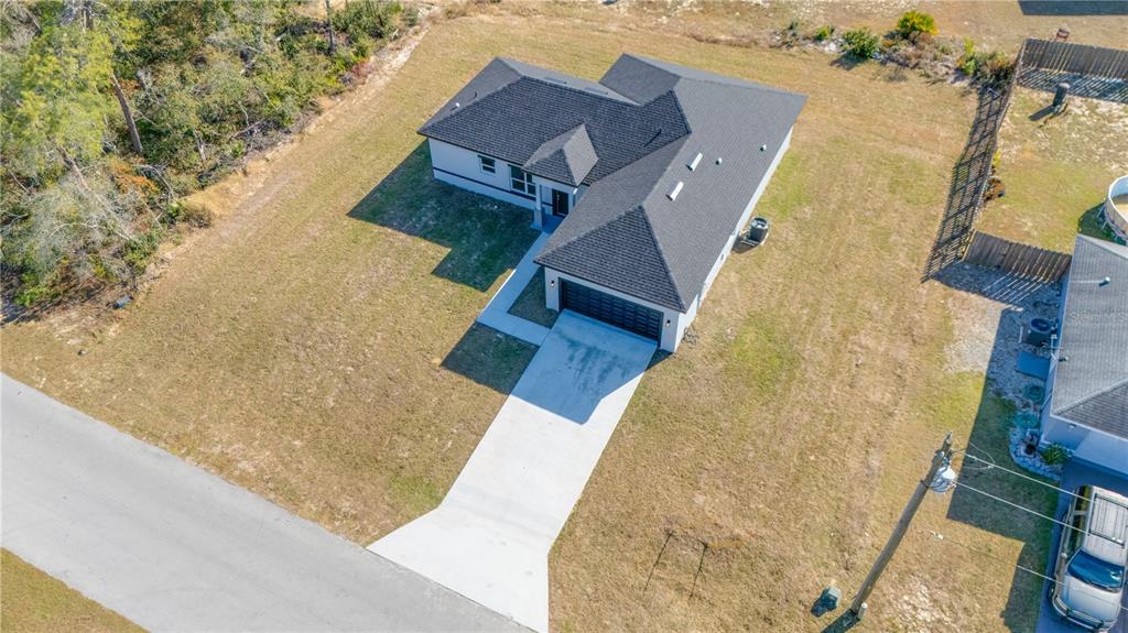3110 Southwest 127th Lane Road Ocala, FL 34473 - Photo 2 of 17 an aerial view of a house with swimming pool