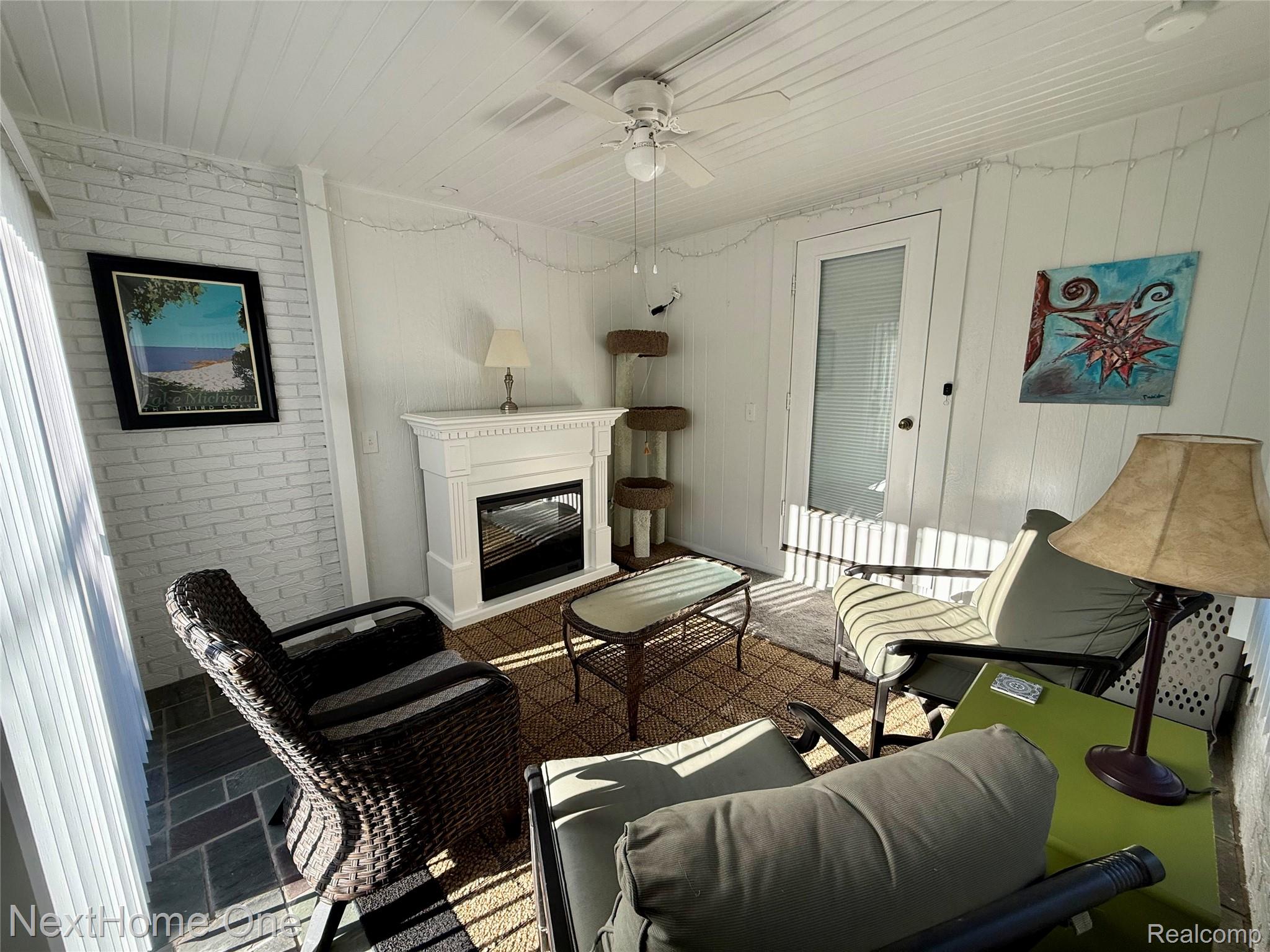 734-736 Briarcliff Road Jackson, MI 49203 - Photo 16 of 30 First Floor 3 Seasons room with electric fireplace