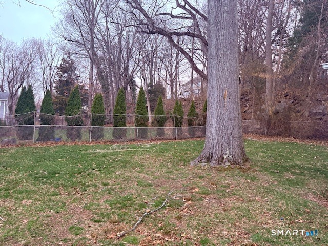 329 Bronson Road Fairfield, CT 06890 - Photo 23 of 25 a backyard of a house with lots of green space