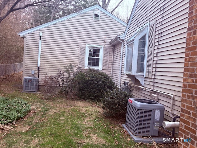 329 Bronson Road Fairfield, CT 06890 - Photo 24 of 25 a view of a house with a yard and garage
