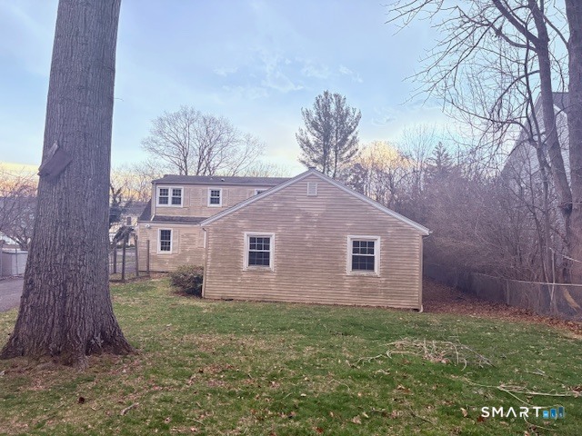 329 Bronson Road Fairfield, CT 06890 - Photo 25 of 25 a front view of a house with a garden