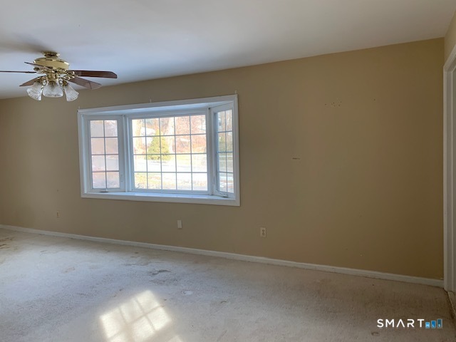 329 Bronson Road Fairfield, CT 06890 - Photo 6 of 25 wooden floor in an empty room with a window
