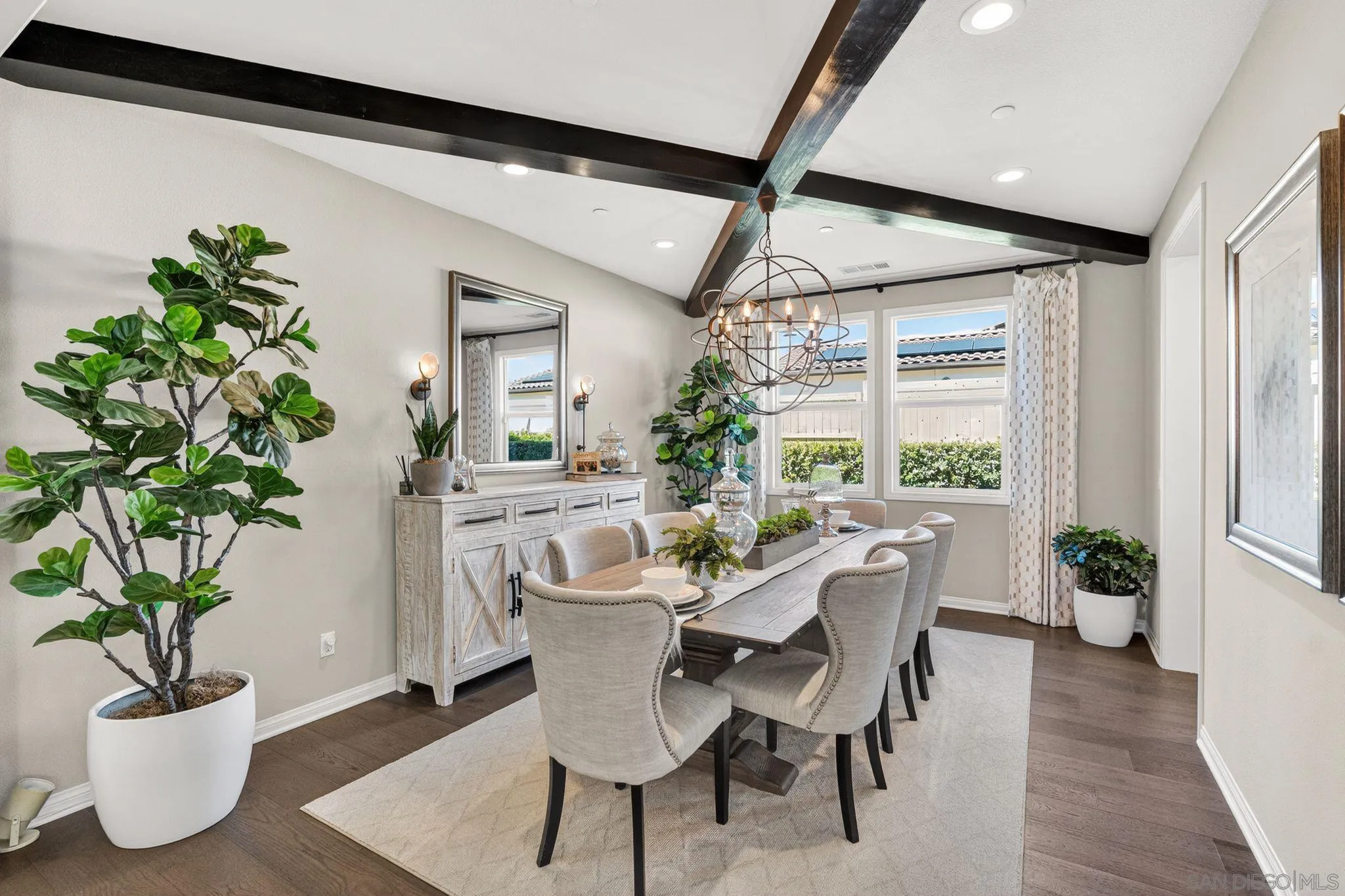 21509 Wilgen Road Escondido, CA 92029 - Photo 5 of 37 a dining room with furniture potted plants and wooden floor