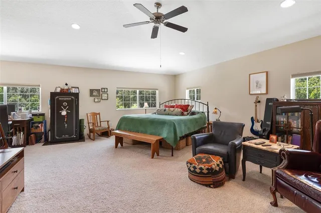 a view of walk in closet with clothes