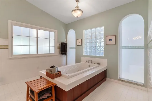 a kitchen with stainless steel appliances granite countertop a stove and a wooden floors