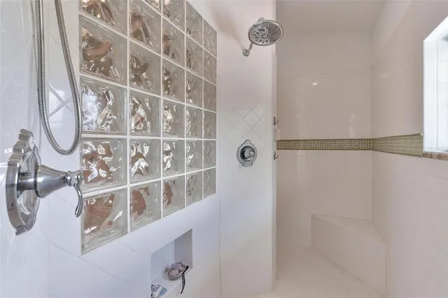 a kitchen with stainless steel appliances kitchen island granite countertop a refrigerator and a stove top oven