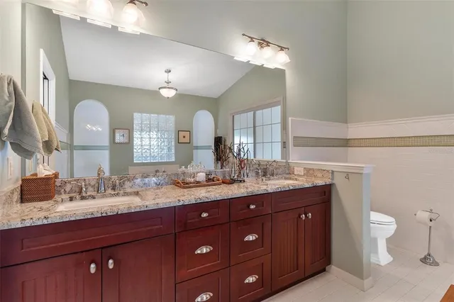 a kitchen with stainless steel appliances granite countertop a stove and a table