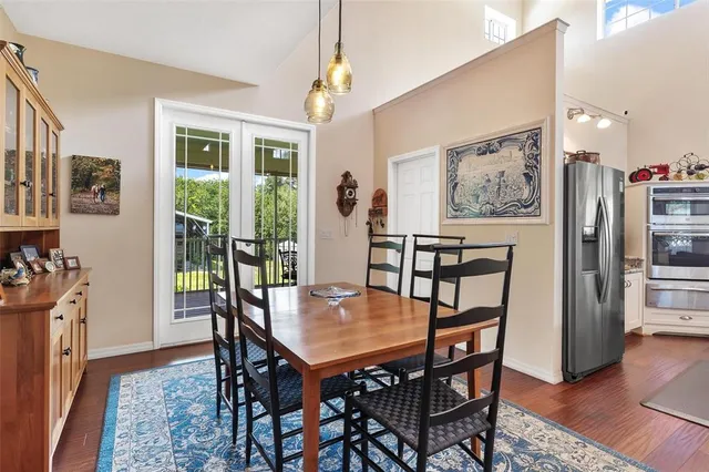a living room with furniture and a floor to ceiling window