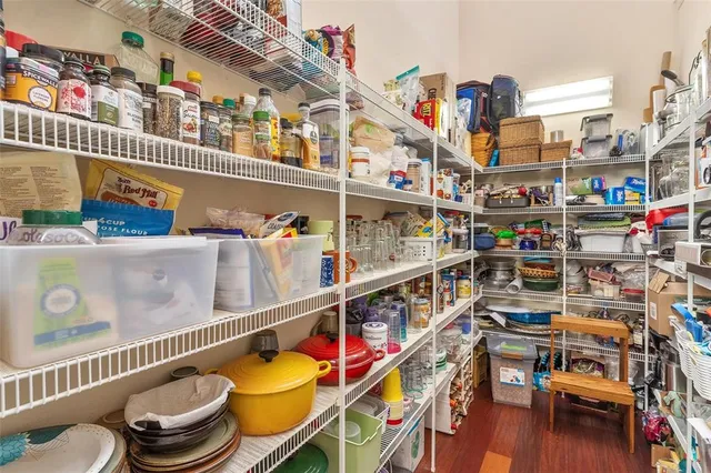 a room that has a bed and a table in it