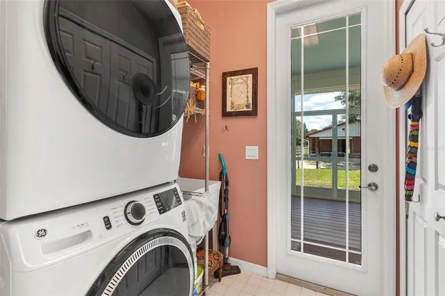 a view of a porch with furniture and a backyard