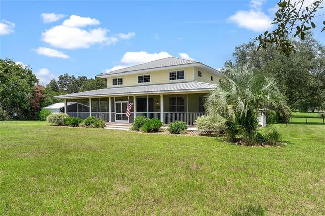 a view of a golf course with a big yard