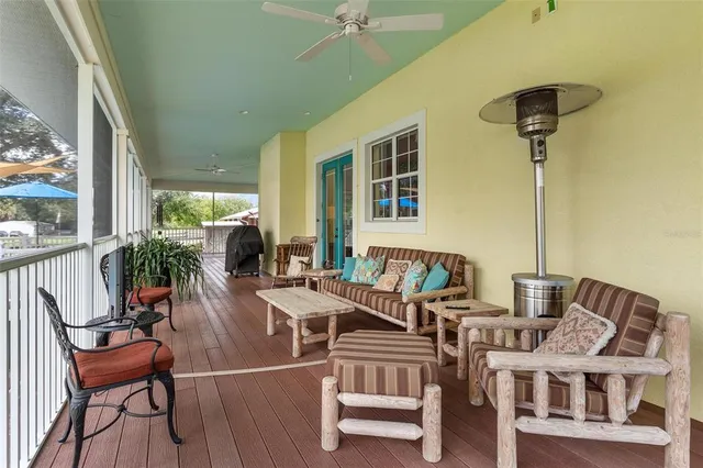 an aerial view of a house with pool yard and outdoor seating