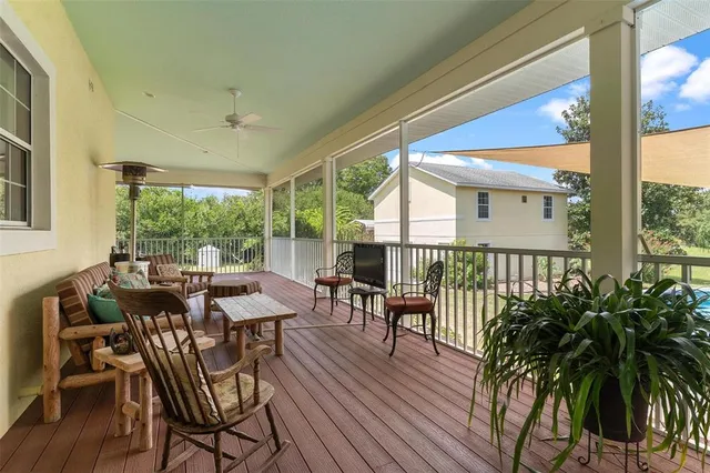an aerial view of a house having yard swimming pool and outdoor seating
