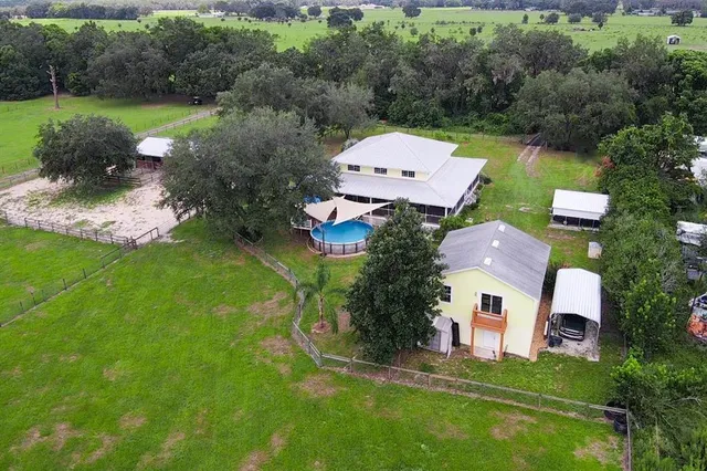 a view of a livingroom with wooden floor and stairs