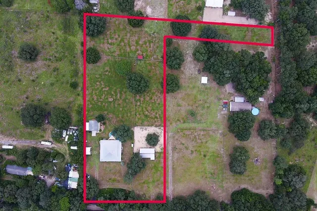 a living room with furniture a ceiling fan and a window