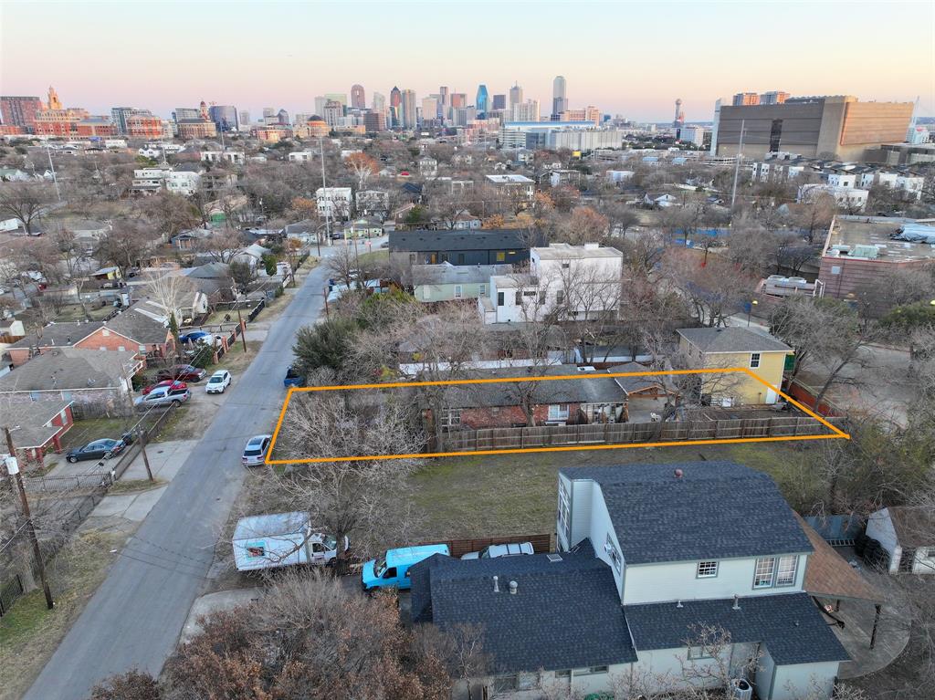 4531 Afton Street Dallas, TX 75219 - Photo 2 of 6 an aerial view of a house with a lake view