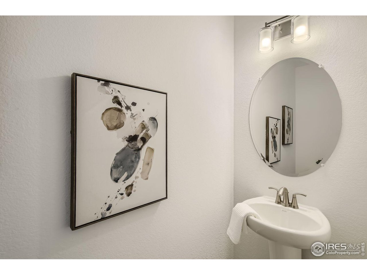 2721 Bear Springs Circle Longmont, CO 80503 - Photo 13 of 27 a bathroom with a sink mirror and vanity