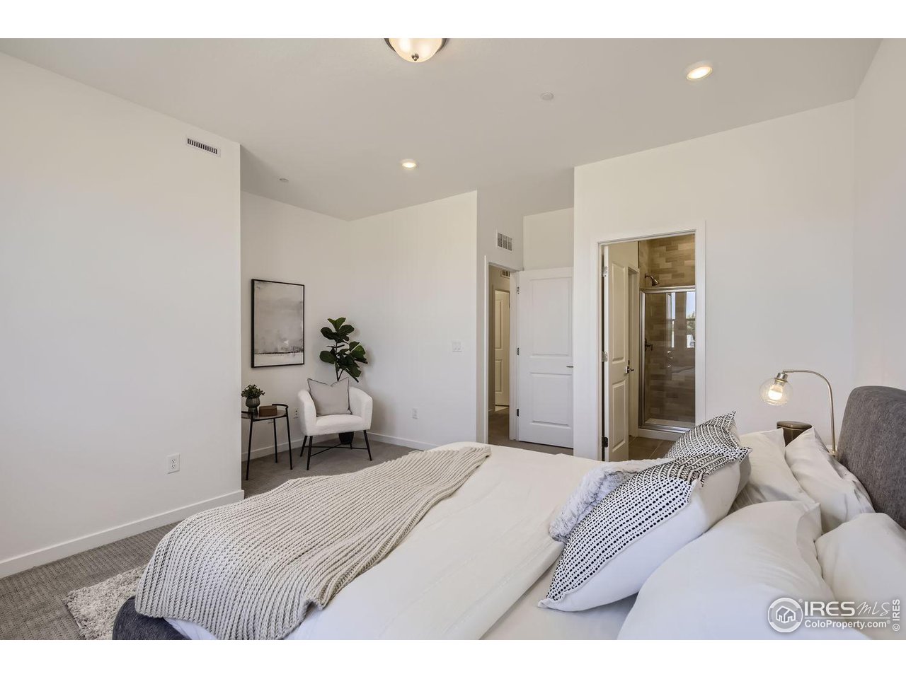 2721 Bear Springs Circle Longmont, CO 80503 - Photo 17 of 27 a bedroom with a bed and a mirror