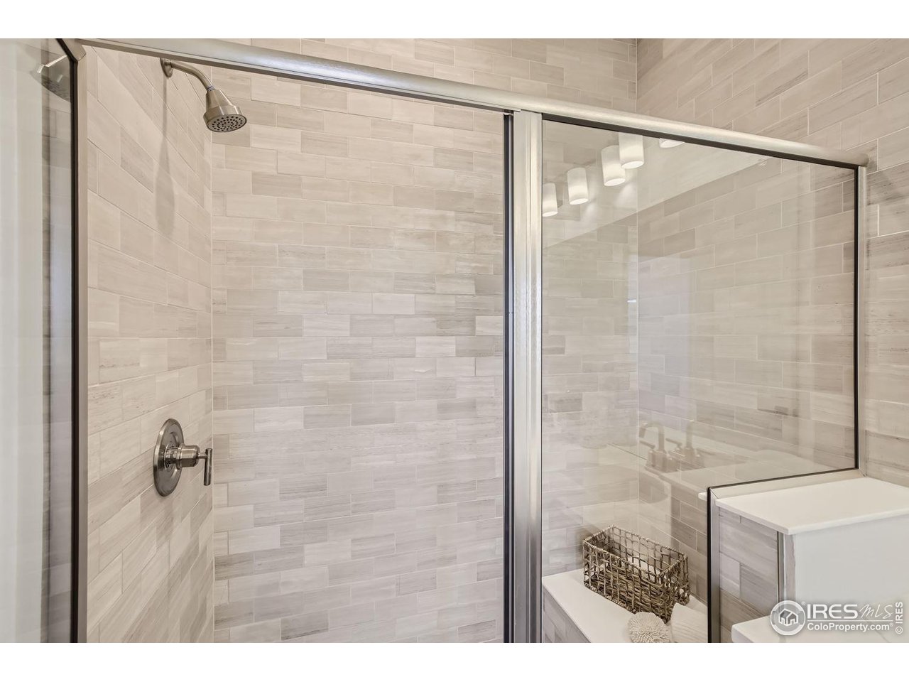 2721 Bear Springs Circle Longmont, CO 80503 - Photo 20 of 27 a bathroom with a shower and a sink