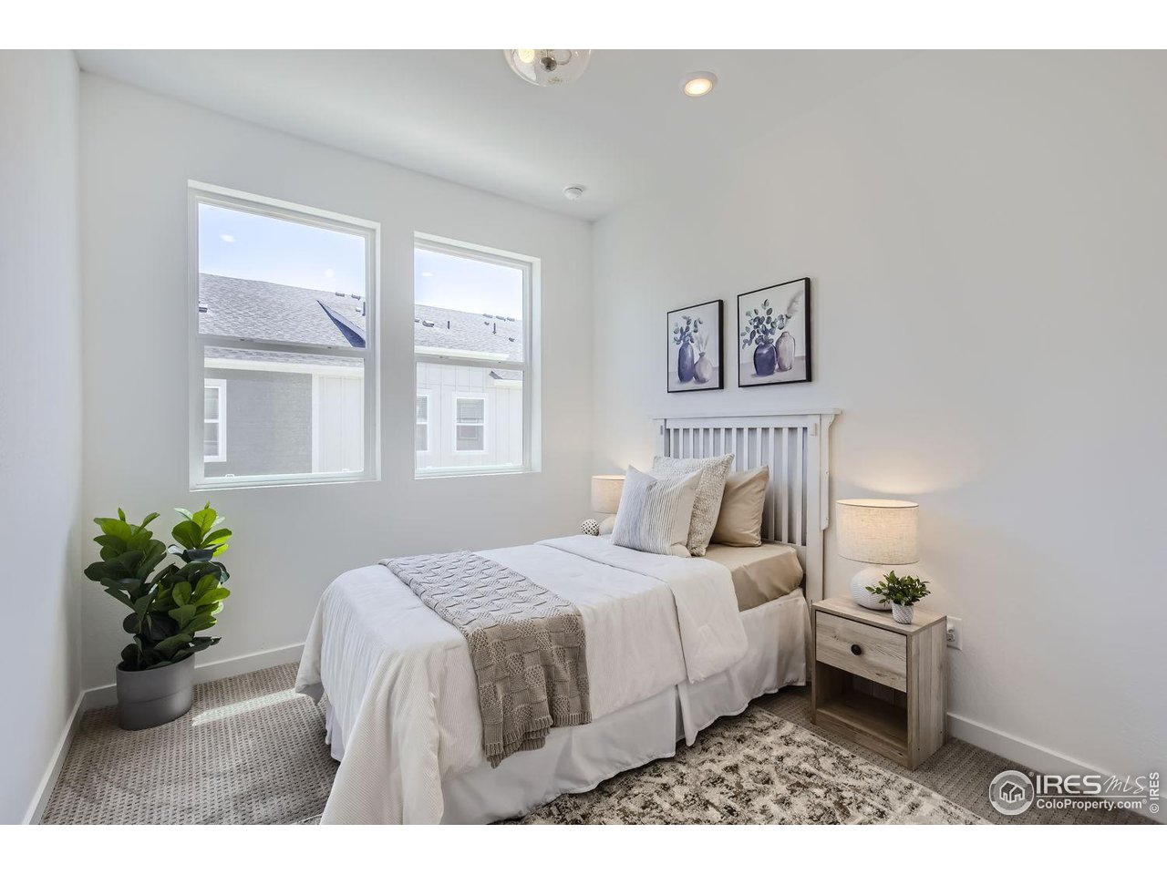 2721 Bear Springs Circle Longmont, CO 80503 - Photo 21 of 27 a bedroom with a bed and a painting on the wall