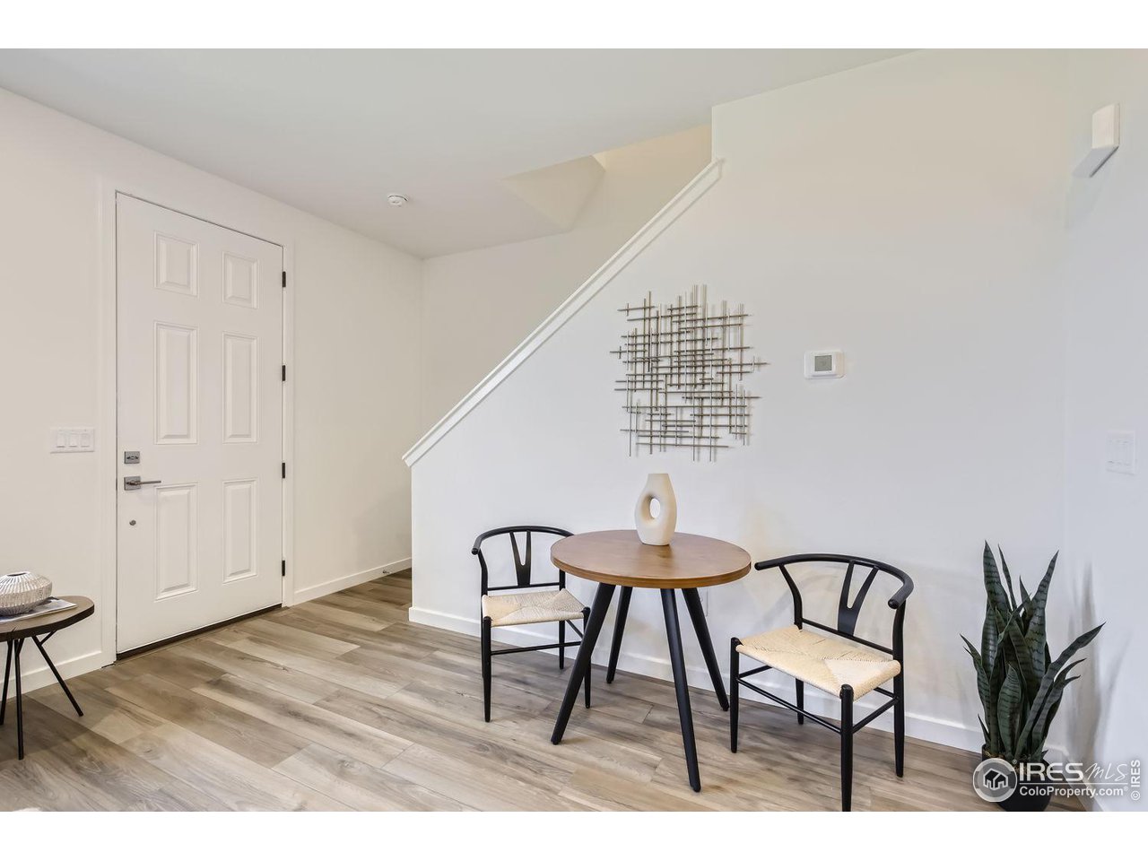 2721 Bear Springs Circle Longmont, CO 80503 - Photo 10 of 27 a view of a livingroom with furniture and wooden floor
