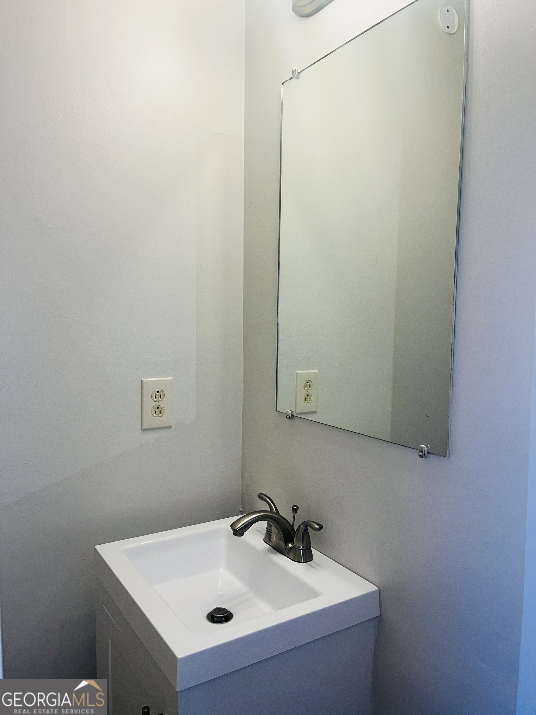 17 Curran Avenue, Unit A LaGrange, GA 30241 - Photo 14 of 25 a bathroom with a sink and a mirror
