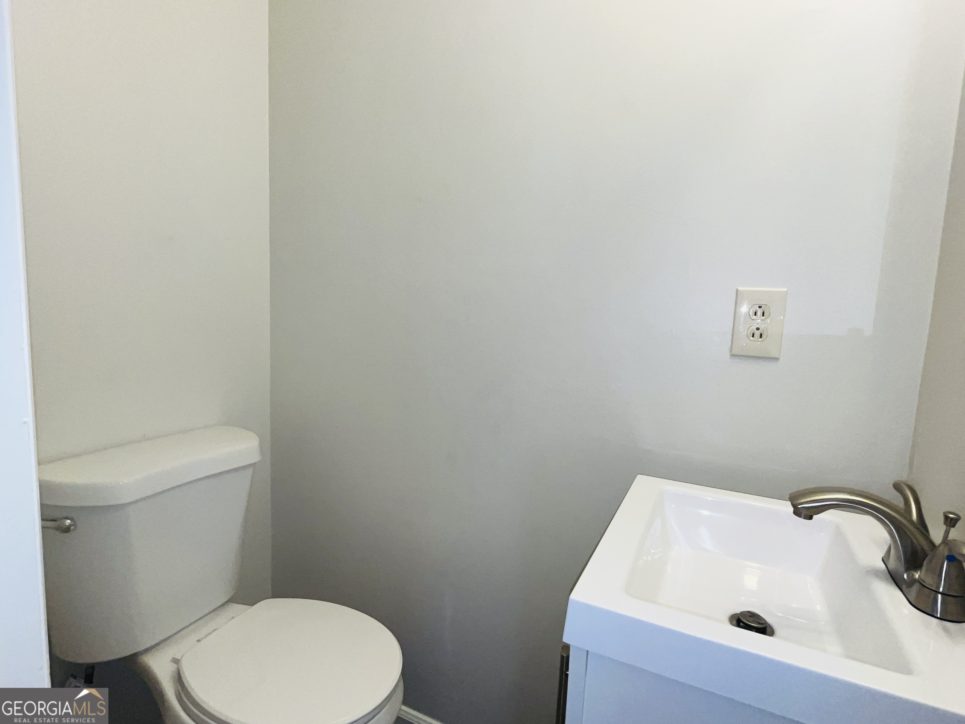 17 Curran Avenue, Unit A LaGrange, GA 30241 - Photo 15 of 25 a white toilet sitting next to a sink