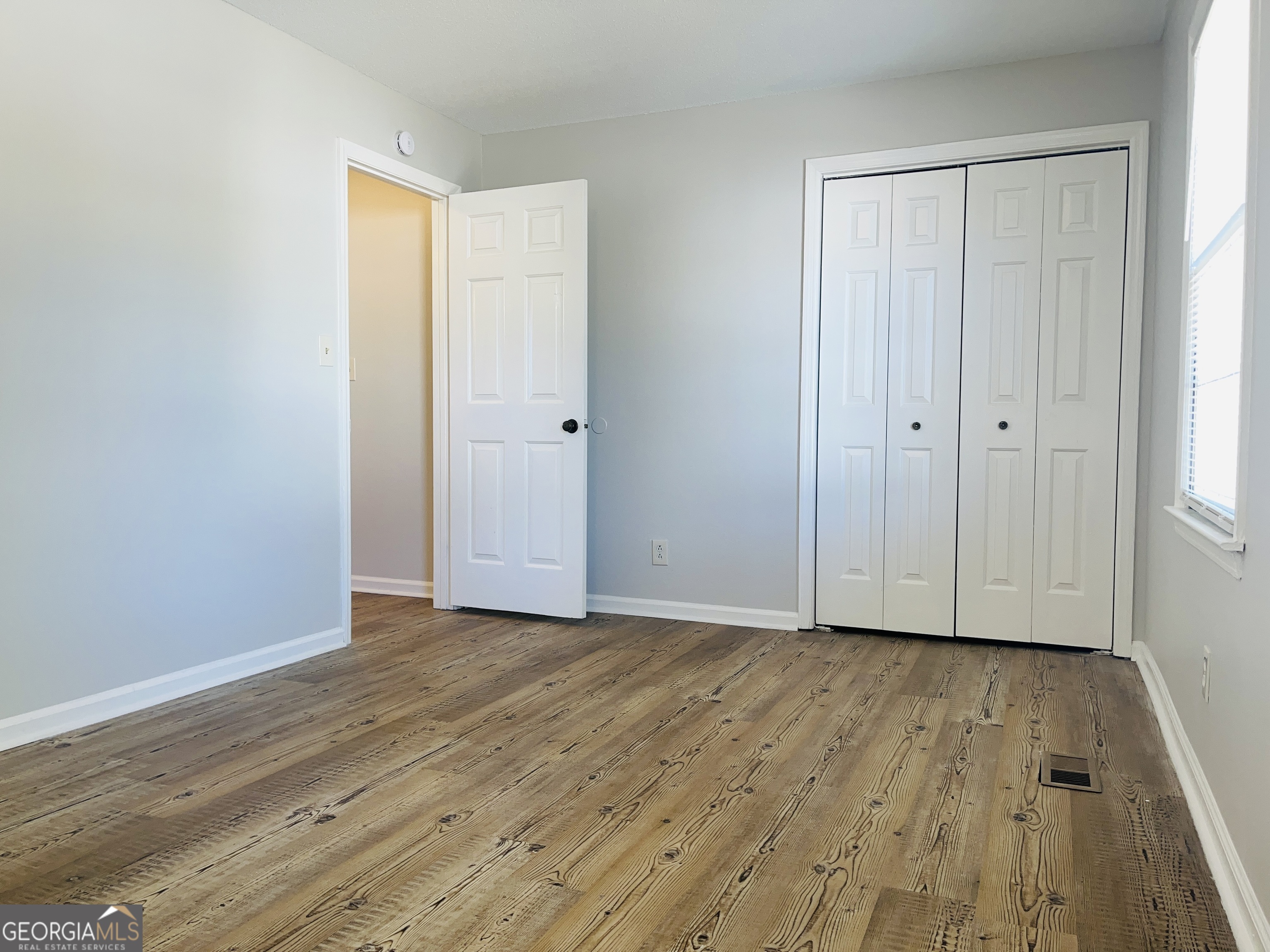 17 Curran Avenue, Unit A LaGrange, GA 30241 - Photo 24 of 25 a view of an empty room and wooden floor