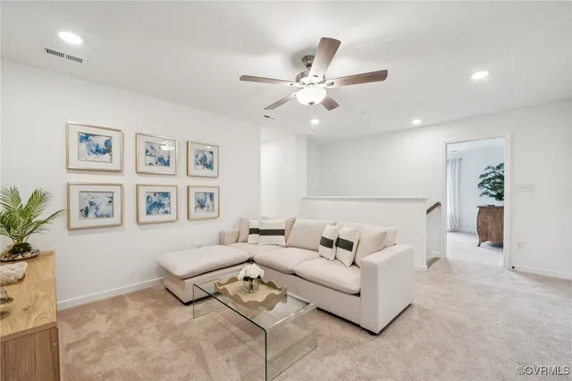 a spacious bedroom with a bed lamp and a large window