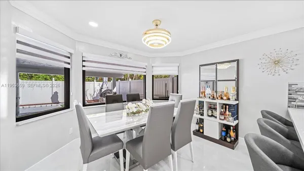 a view of a dining room with furniture window and outside view